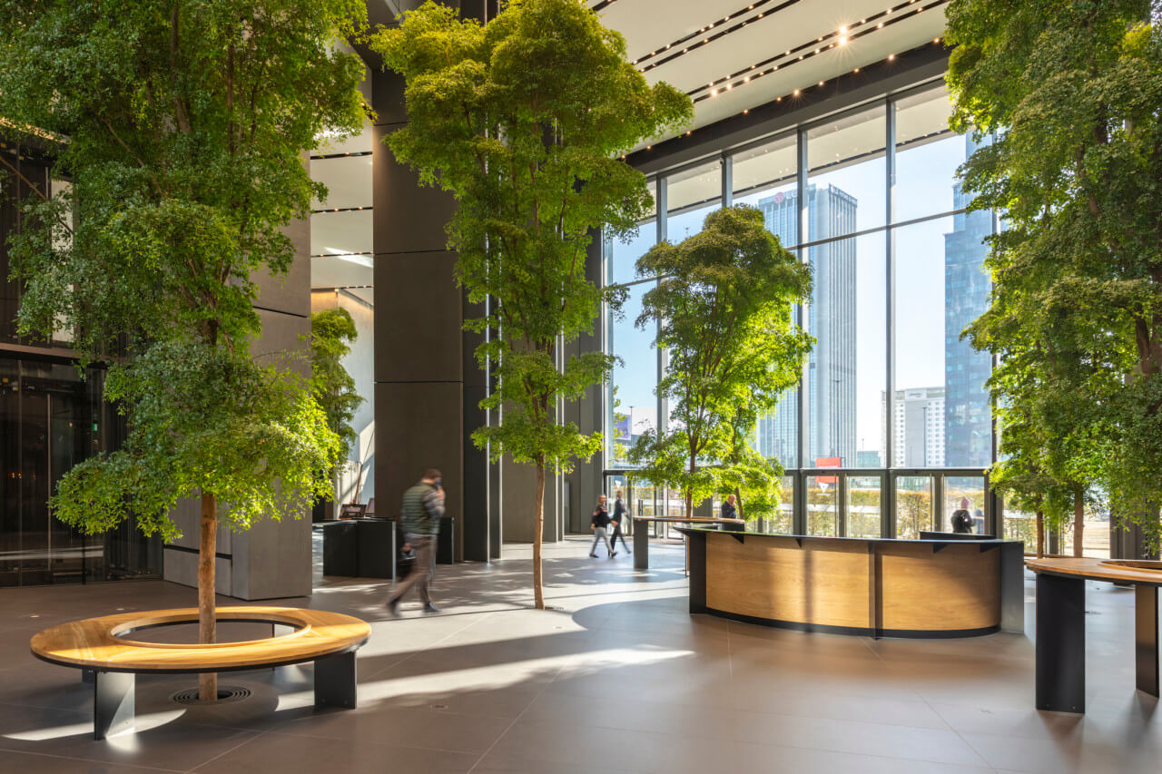 a greenery-clad social space in an office tower