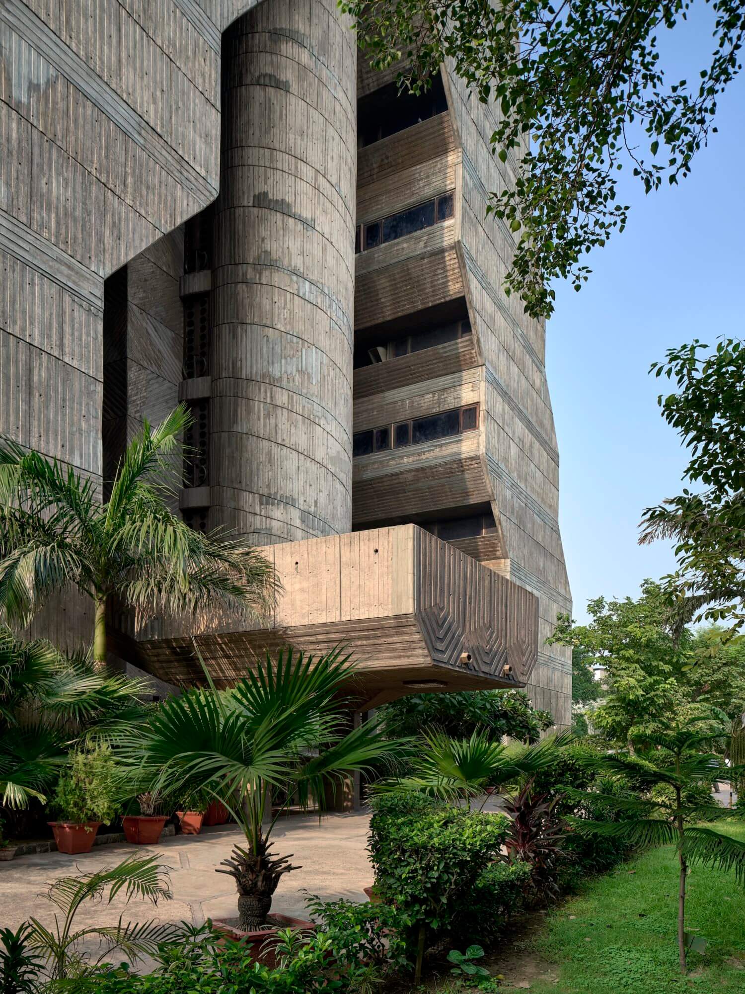 photograph depicting the exterior of an office tower clad in concrete with few windows