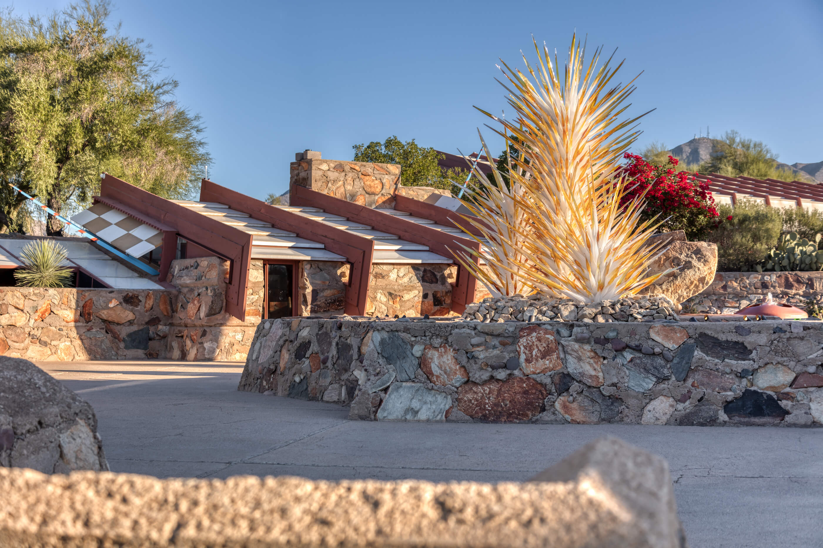 a monumental sculpture by dale chihuly at the entry to plaza to taliesin west in arizona