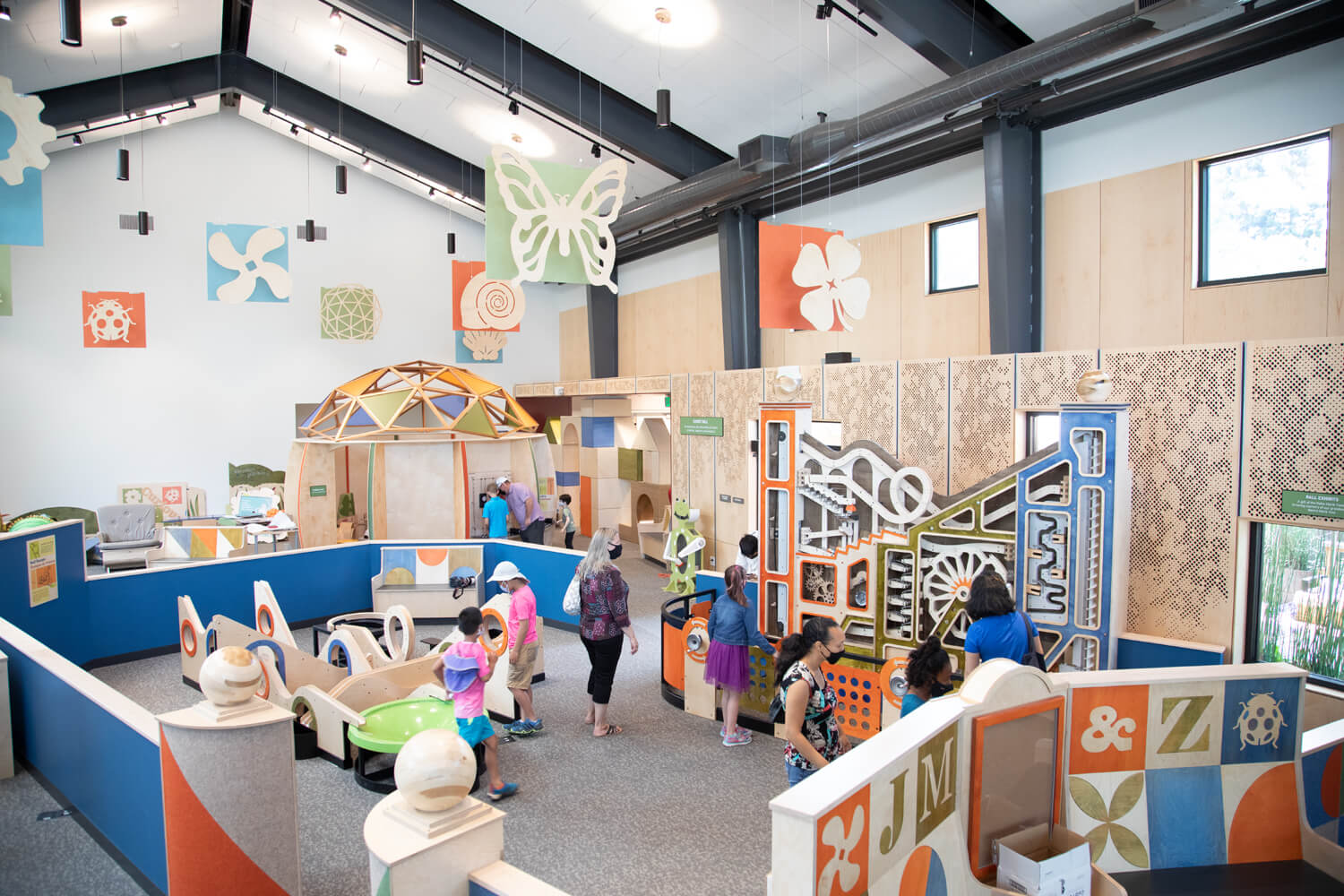 view of a busy exhibit hall at a children's museum
