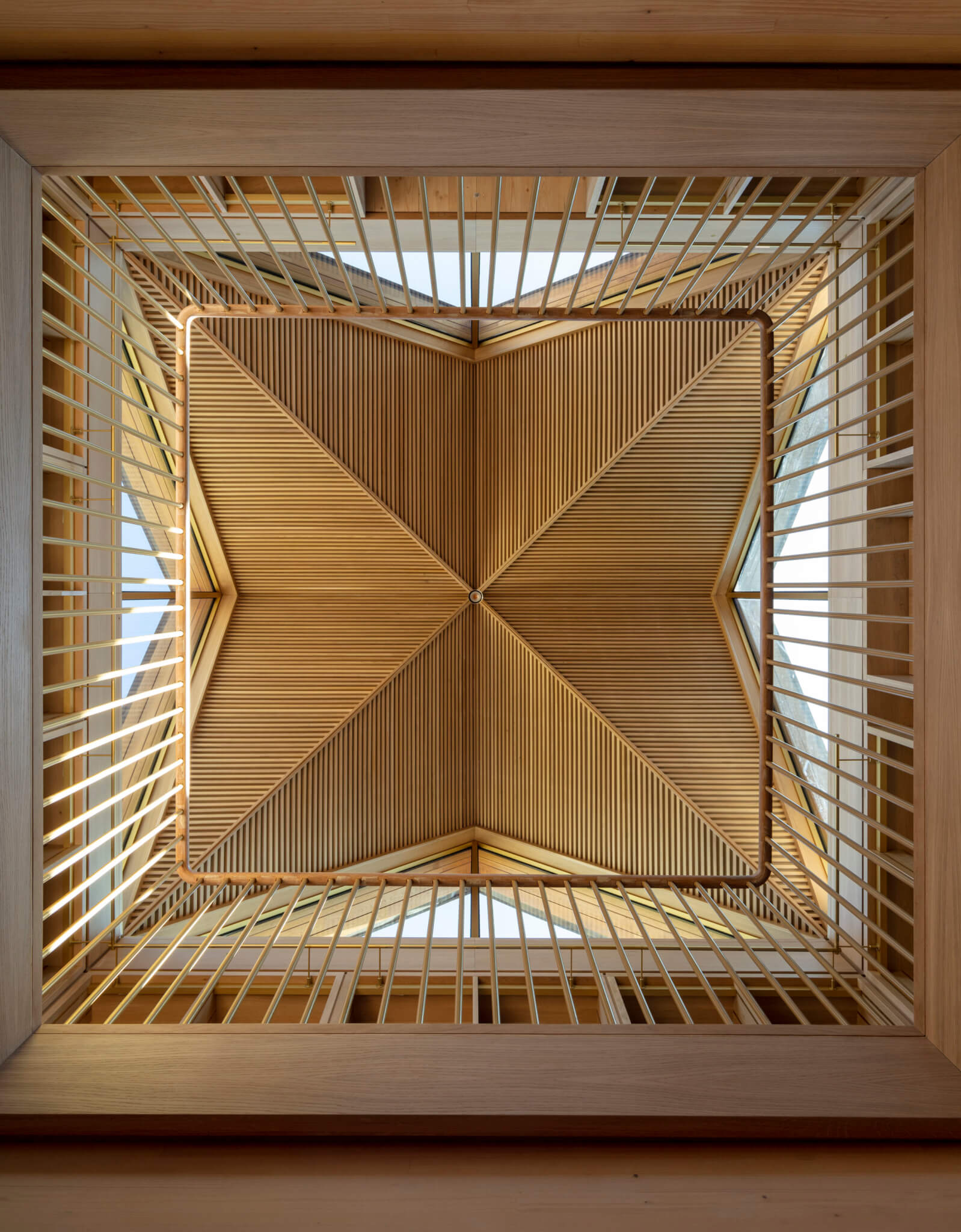 looking up at a intricate wood skylight