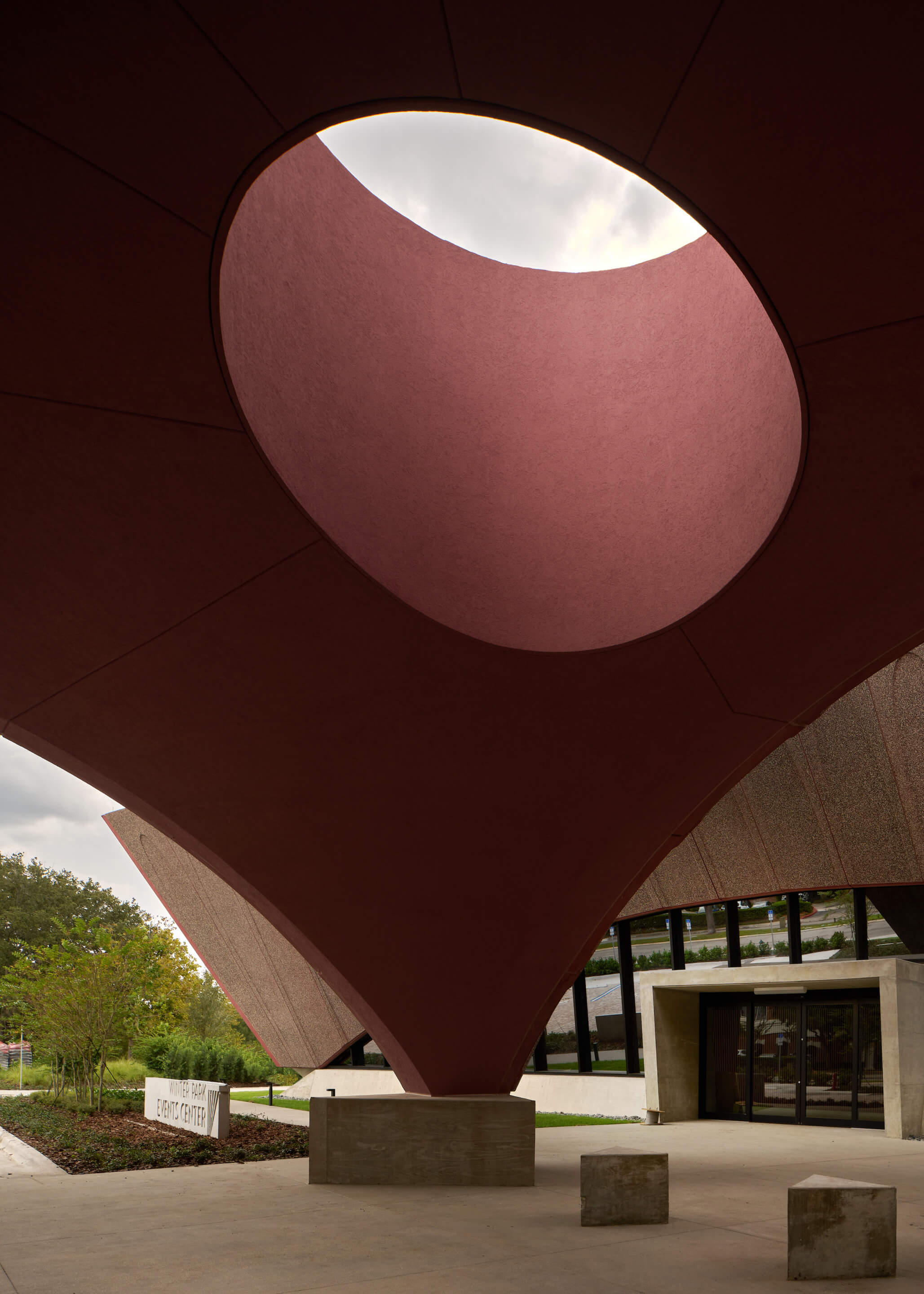 an entrance pavilion to an events center with a large oculus 