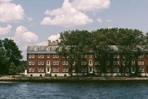 view of a historic building from the water on governors island