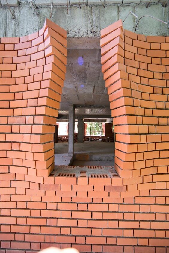 The U-shaped brick opening around a window
