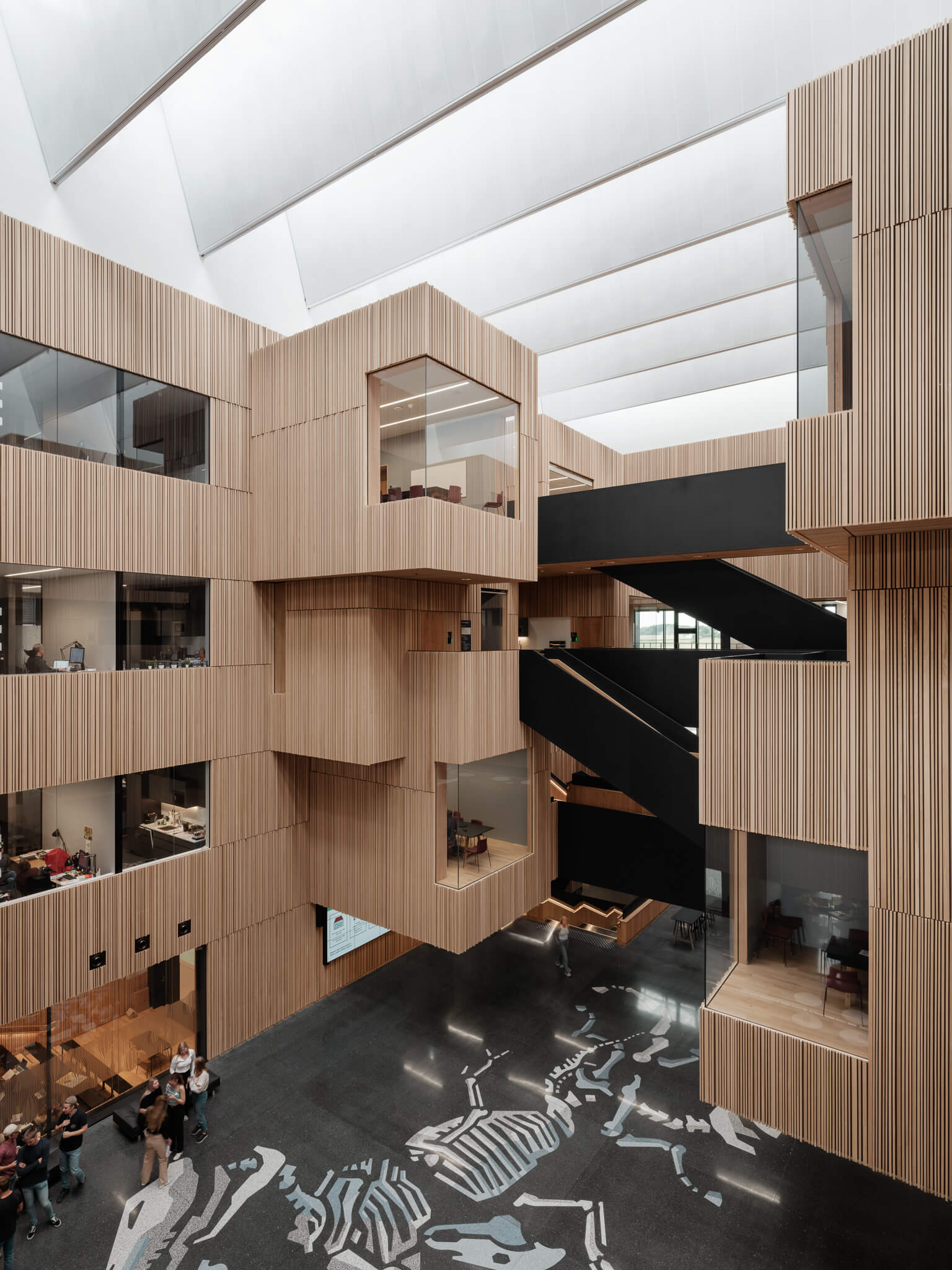 an open atrium with boxy office and classroom space