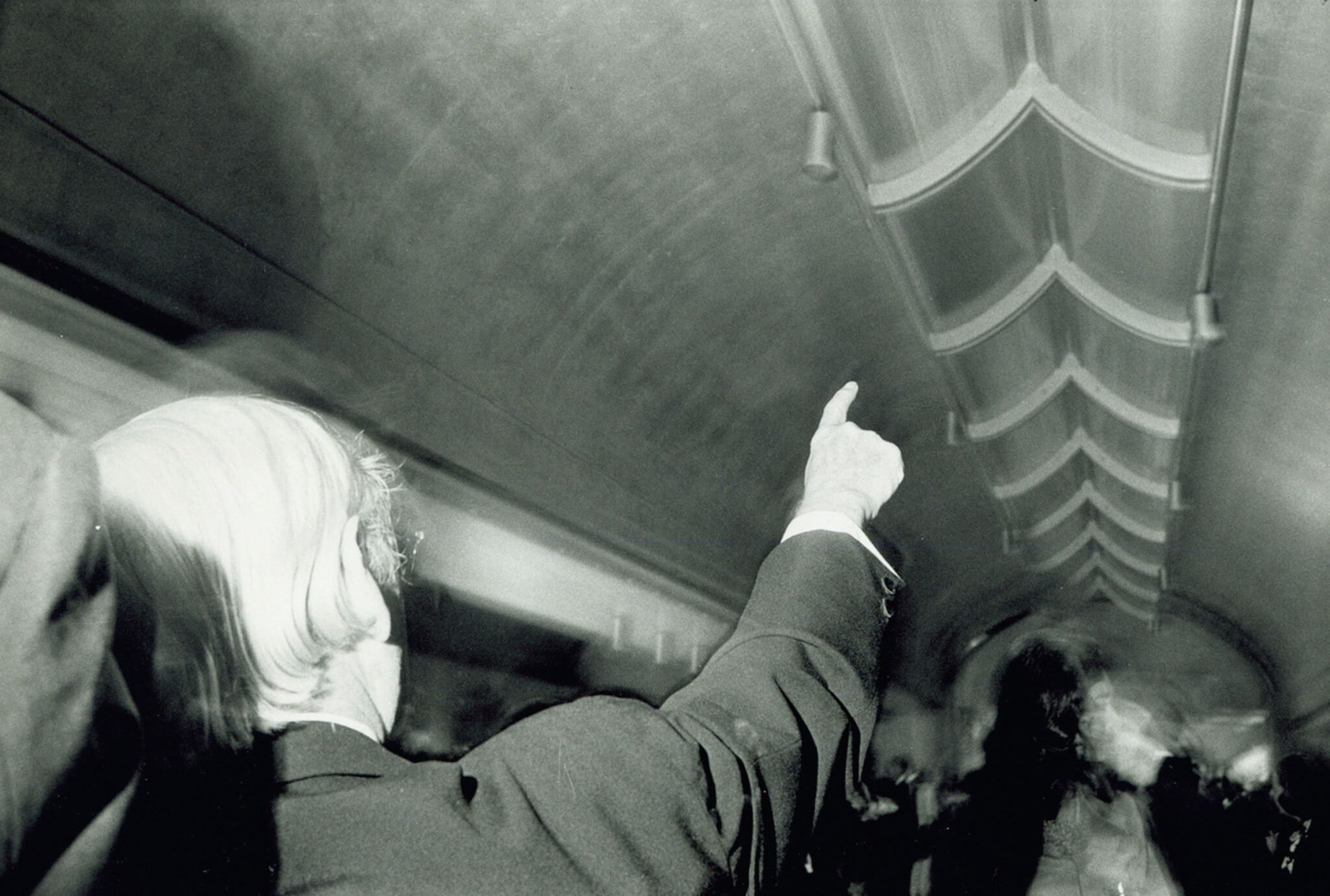 black and white photo of architect louis kahn pointing upward