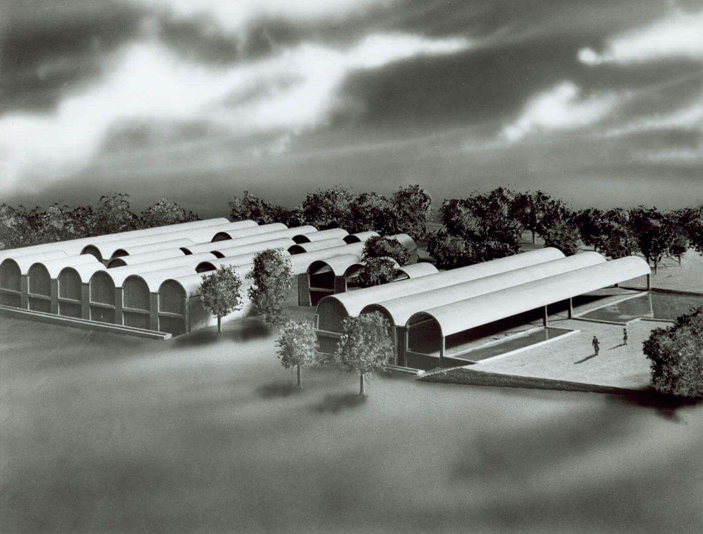 model photograph of a museum building with a barrel-vaulted roof