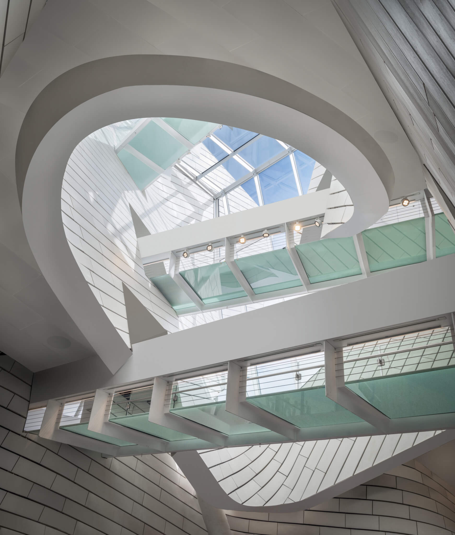 glass and steel bridges crossing through a soaring atrium
