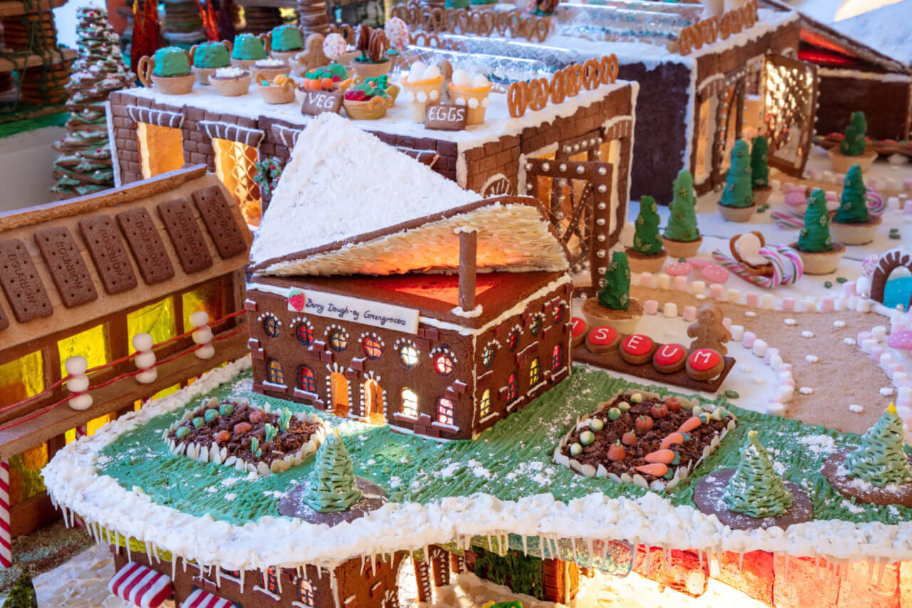 a gingerbread house with raised roof