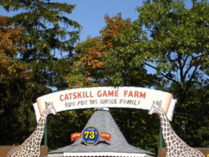 entrance signage to an abandoned zoo that reads the catskill game farm