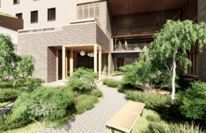Exterior of the new University Health Services Building with a garden around the entrance