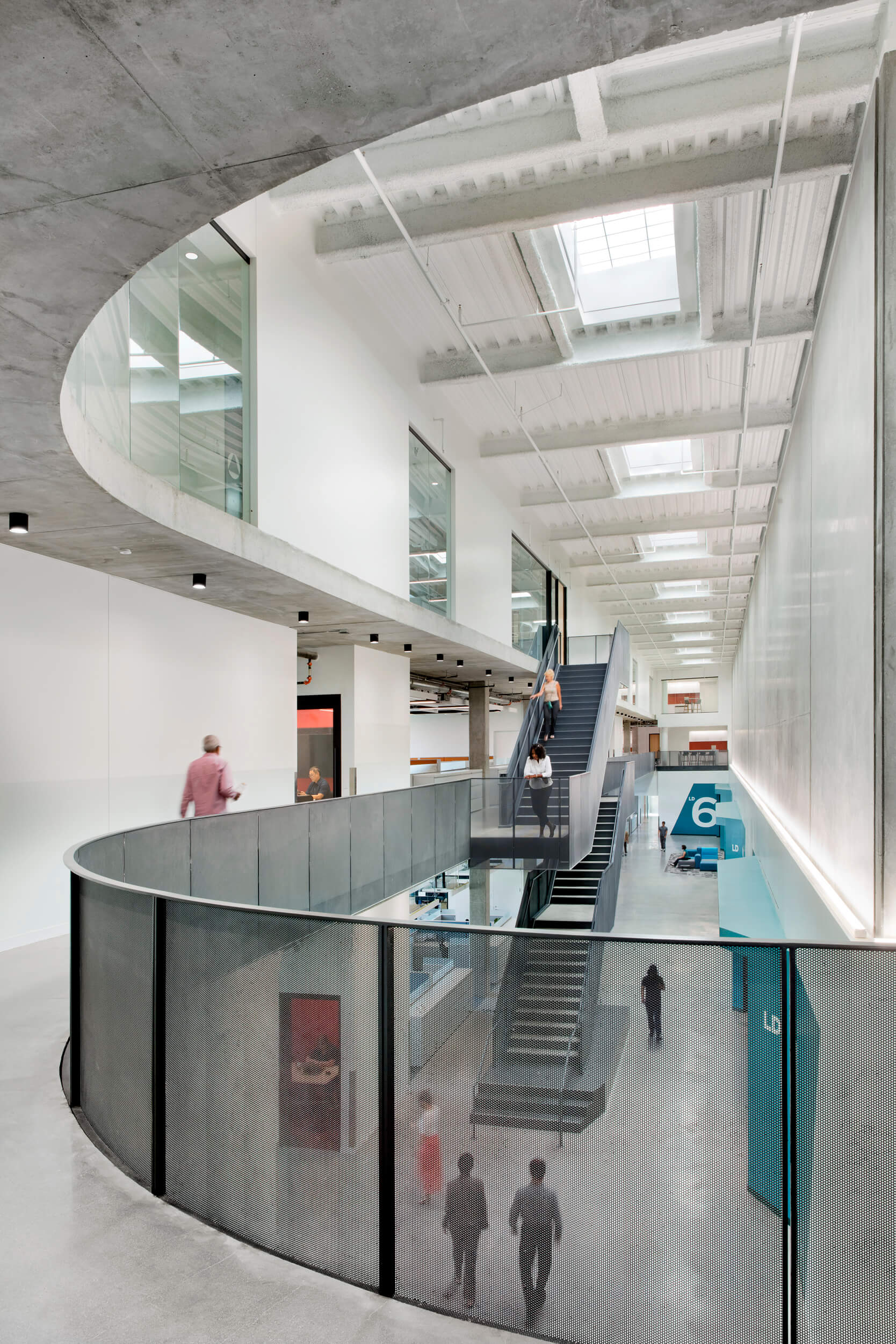 interior of an office space with bridges and stairs