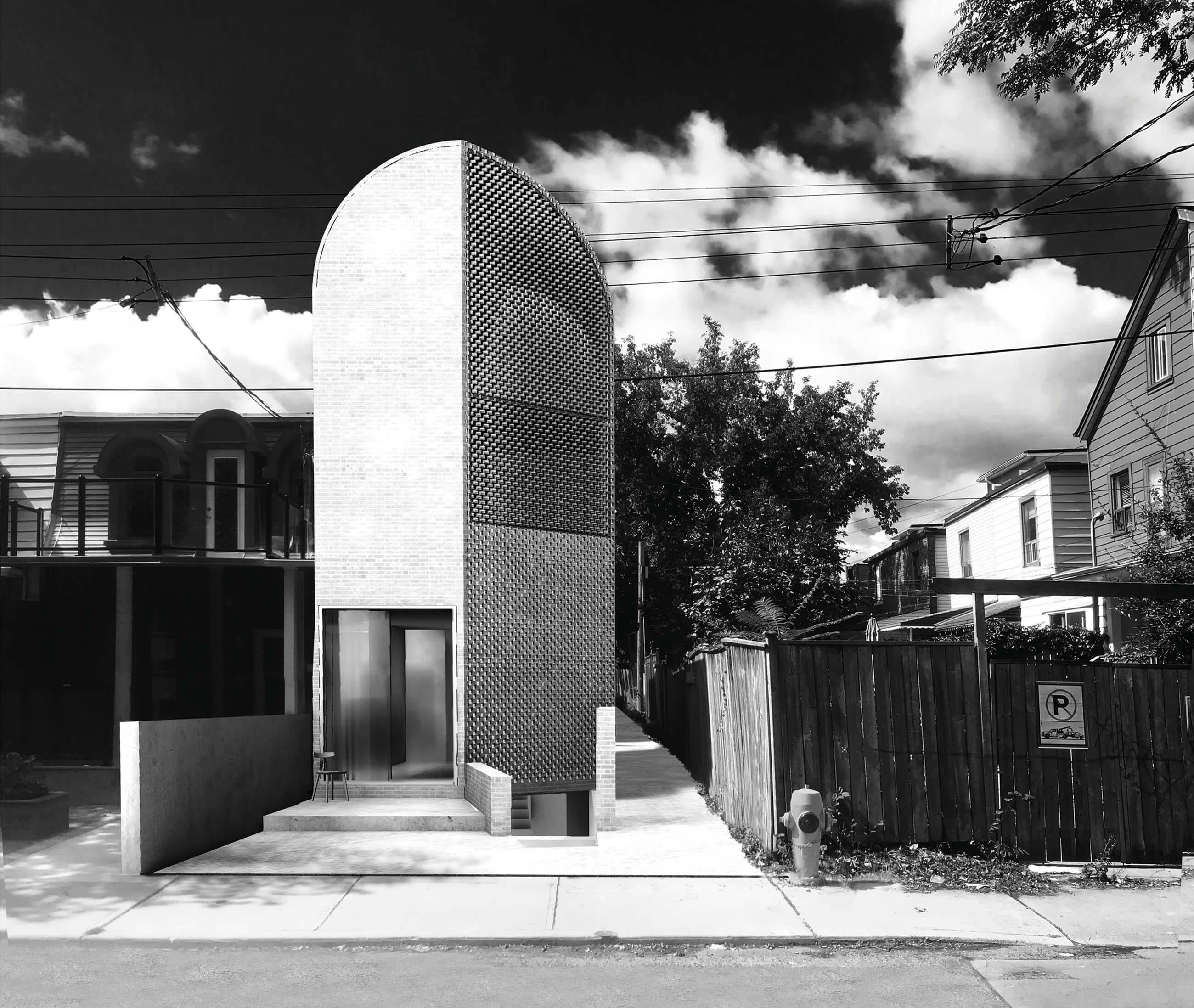 black and white photo of a sculptural building in a narrow infill lot