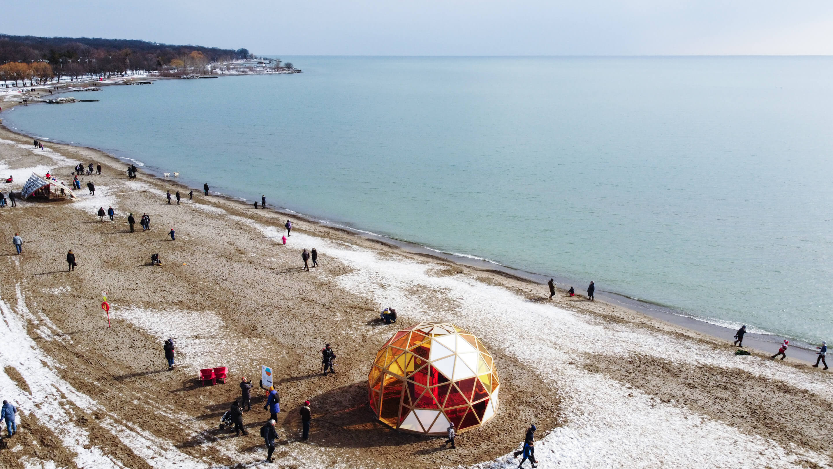 aerial view of a dome-shaped pavilion on a beach