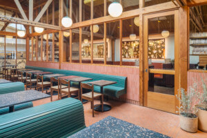 inside Bacetti, a roman inspired restaurant with exposed wood trusses