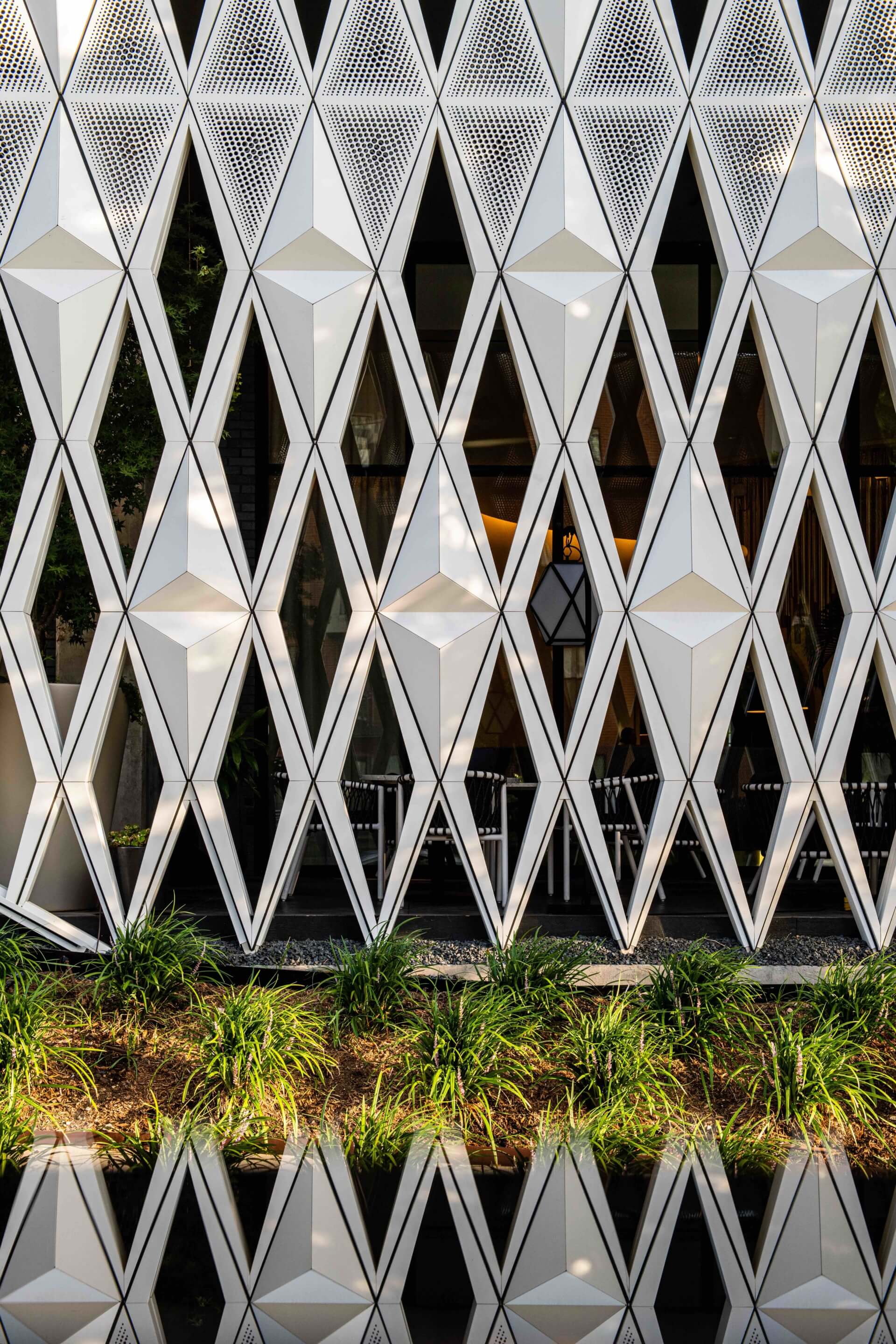 perforated aluminum panels across the virgin hotel with views out of rooms