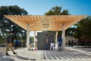 a timber pavilion with a cross-hatched timber canopy from Tsz Yan Ng Design