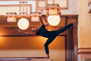 a dancer wedged in between the fixtures at unity temple