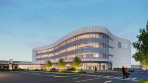 exterior rendering of a healthcare building at twilight that used to be the marketplace mall
