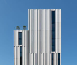 a slender condo tower with precast concrete facade