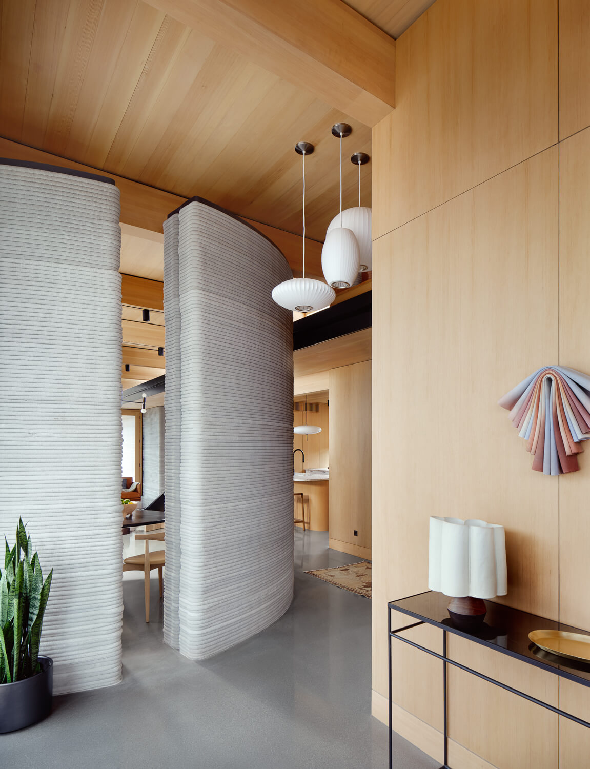 interior of a home with timber wall and ceilings and concrete wall system