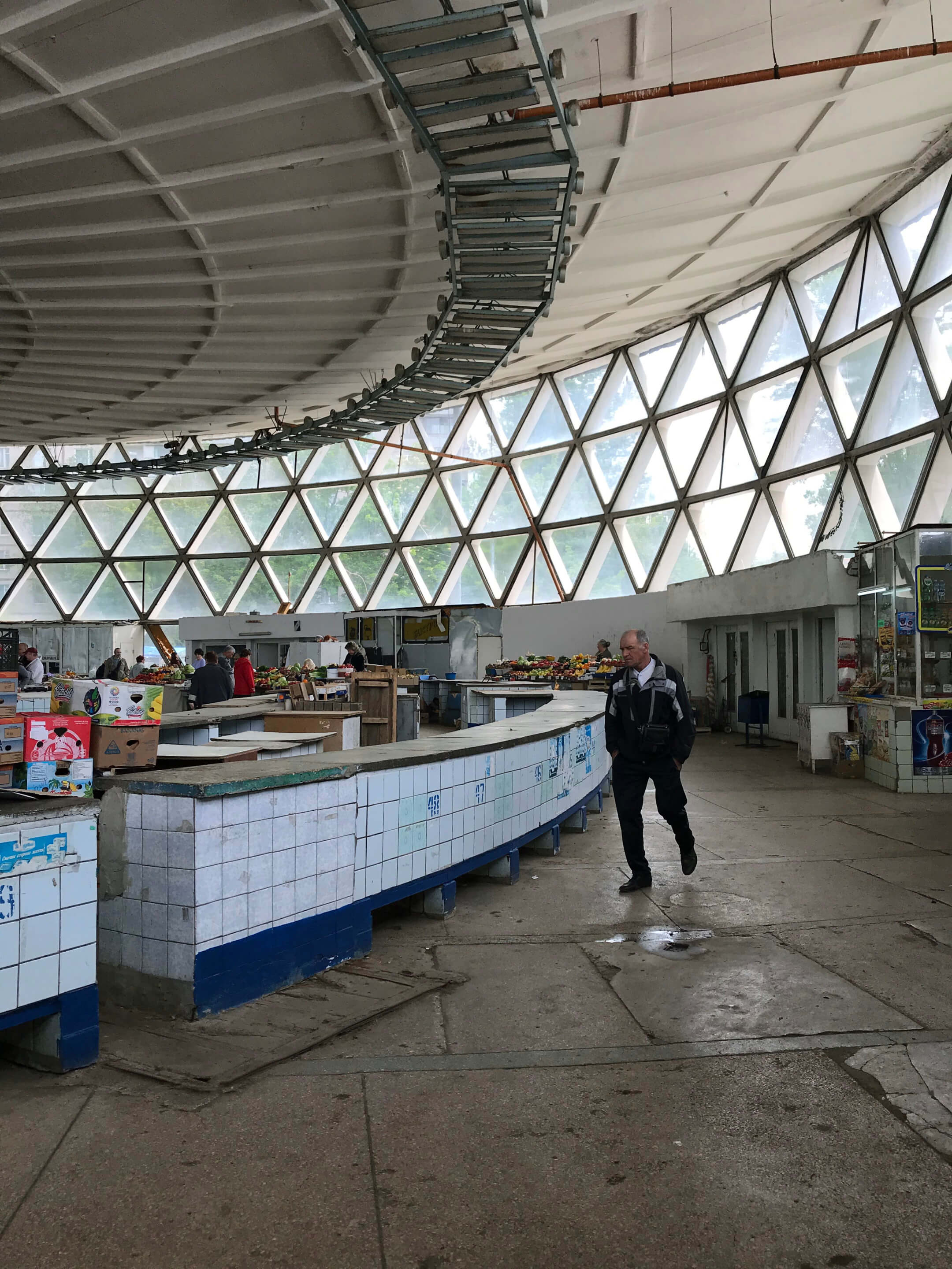interior of a market hall with exposed glass triangles