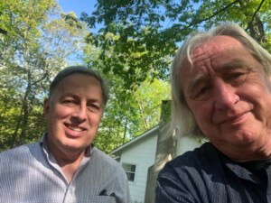 Kevin Lippert and Steven Holl in front of a house