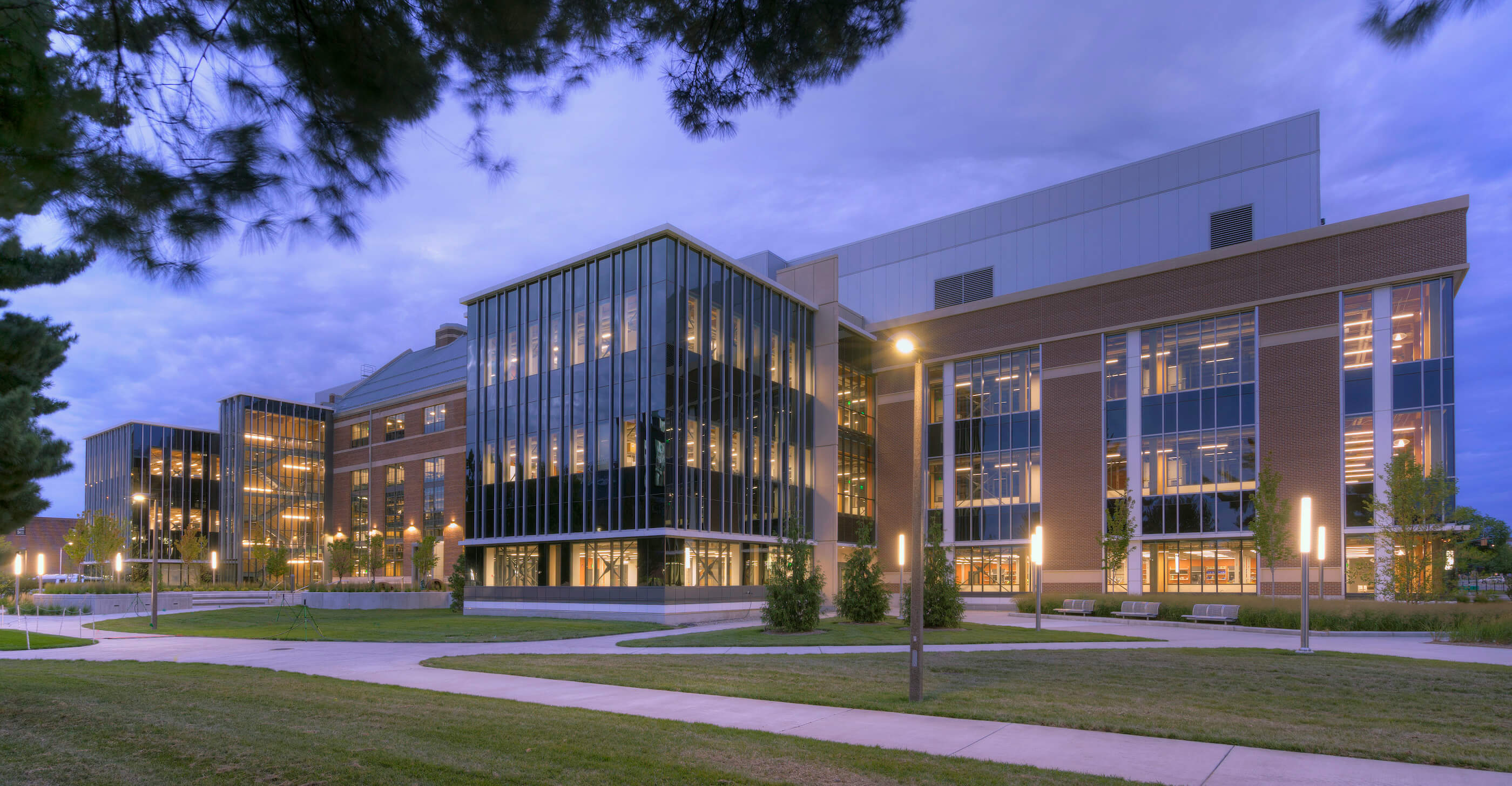 exterior view of a large campus research building at night
