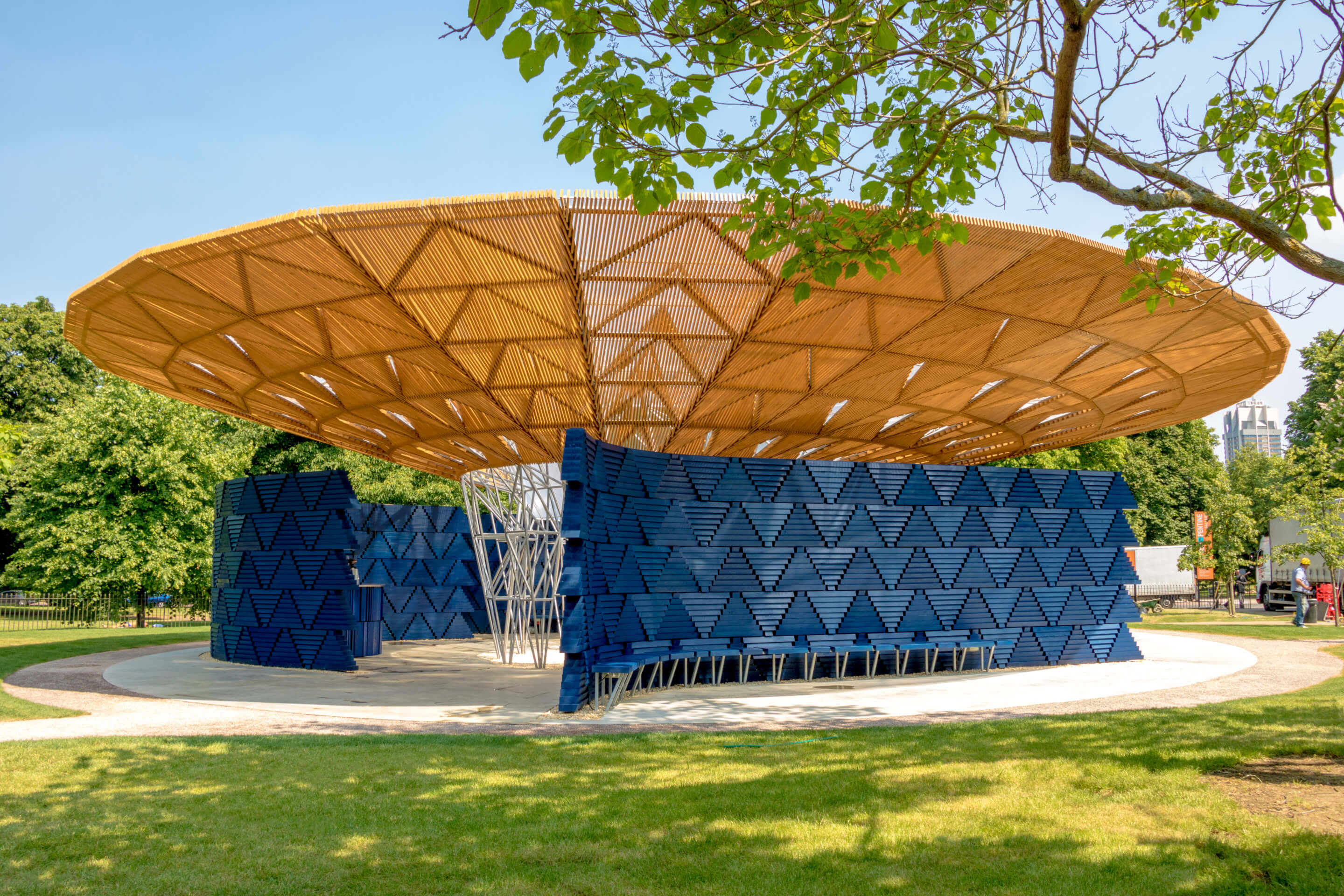 view of a temporary pavilion with blue walls and a large circular roof
