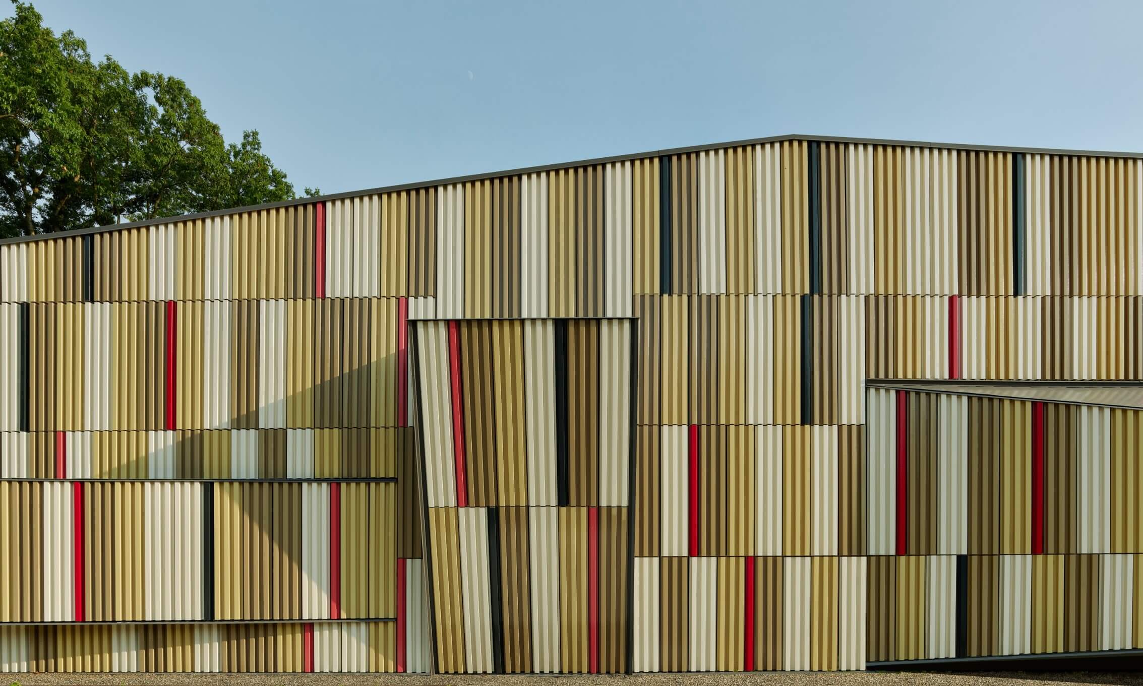 A wall of corrugated metal panels, to be shown at facades+ nyc