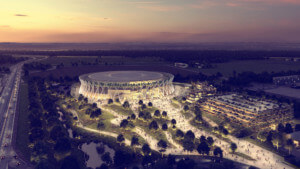 aerial view of circular arena at night, surrounded by a park