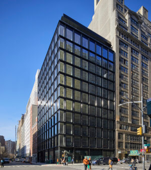 Street view of a glass and terra-cotta building in Manhattan