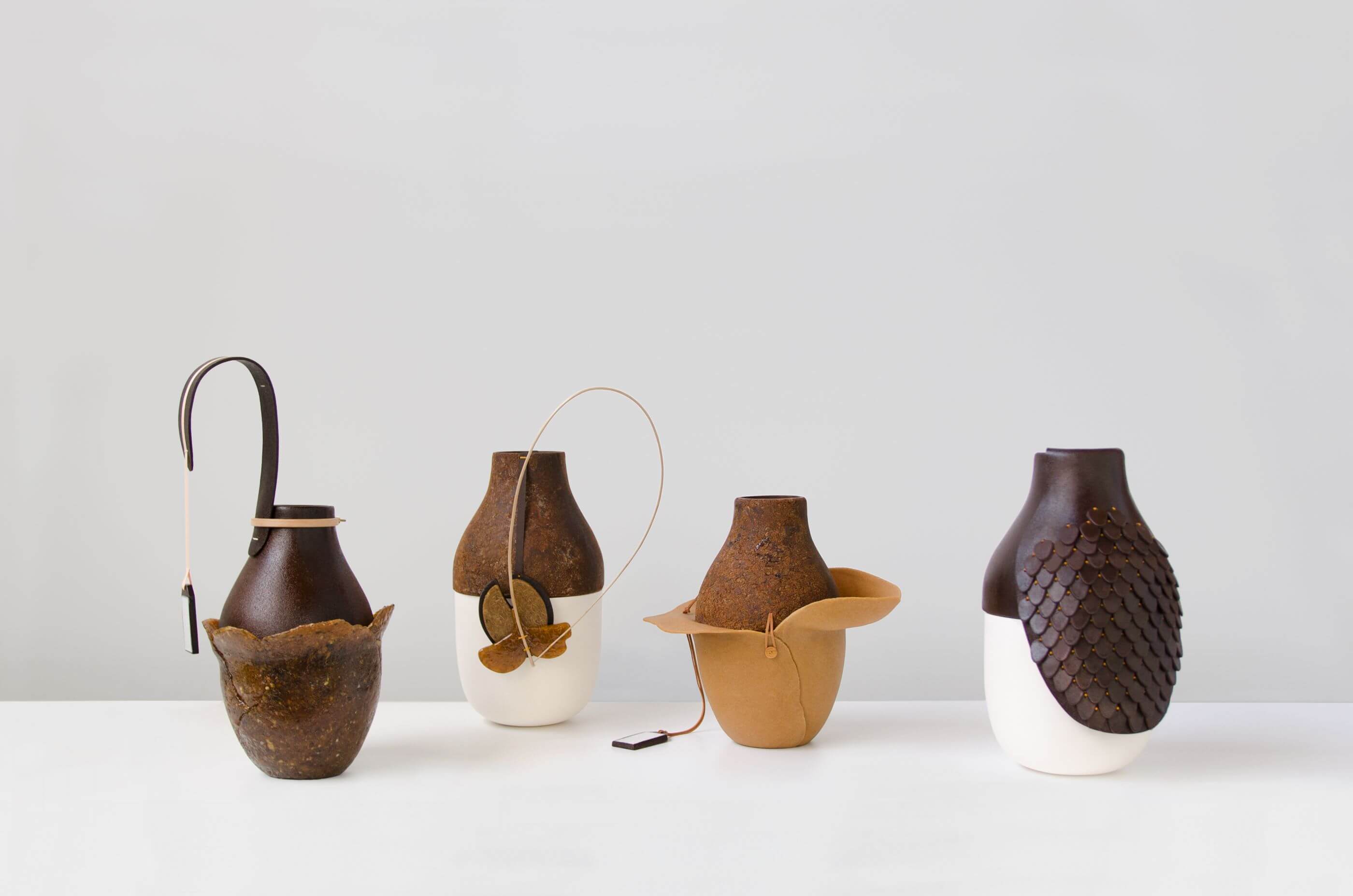 four earth toned vases by Formafantasma