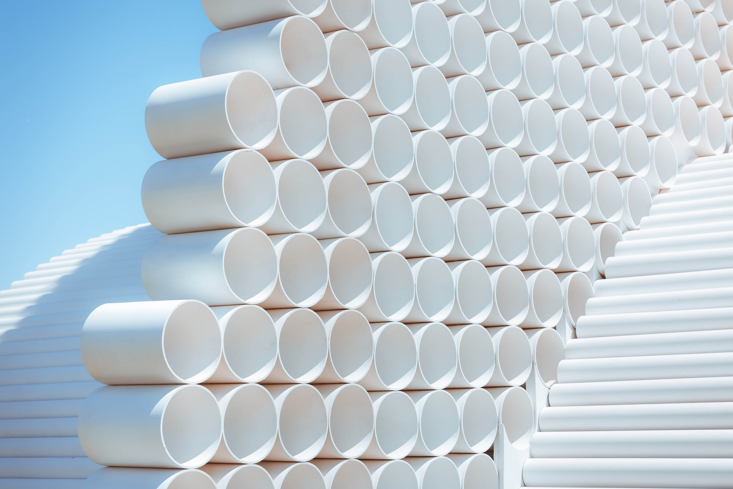 detail view of an art installation constructed from white pvc pipes