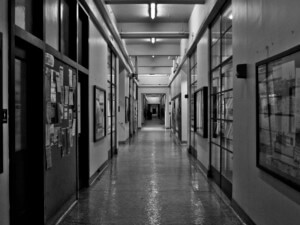 b&w photo of an empty corridor in a university building