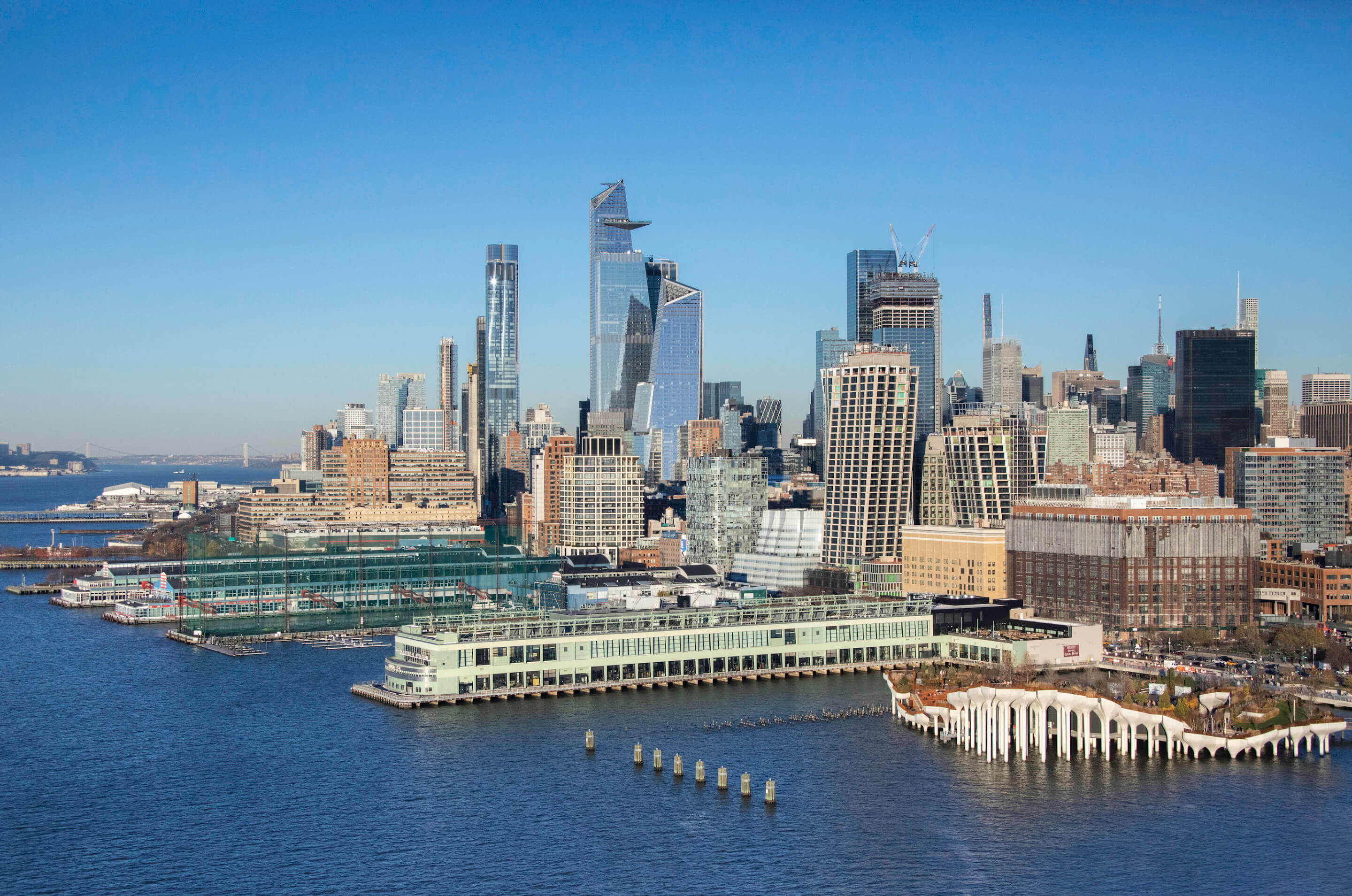view of piers and buildings along the Hudson River waterfront in Manhattan