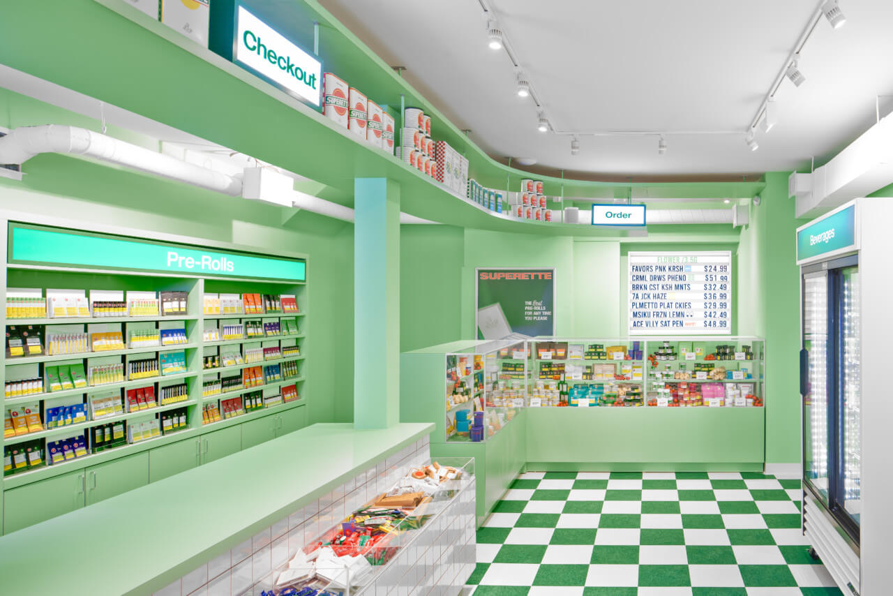 a deli-inspired weed dispensary with checkered flooring and product cases