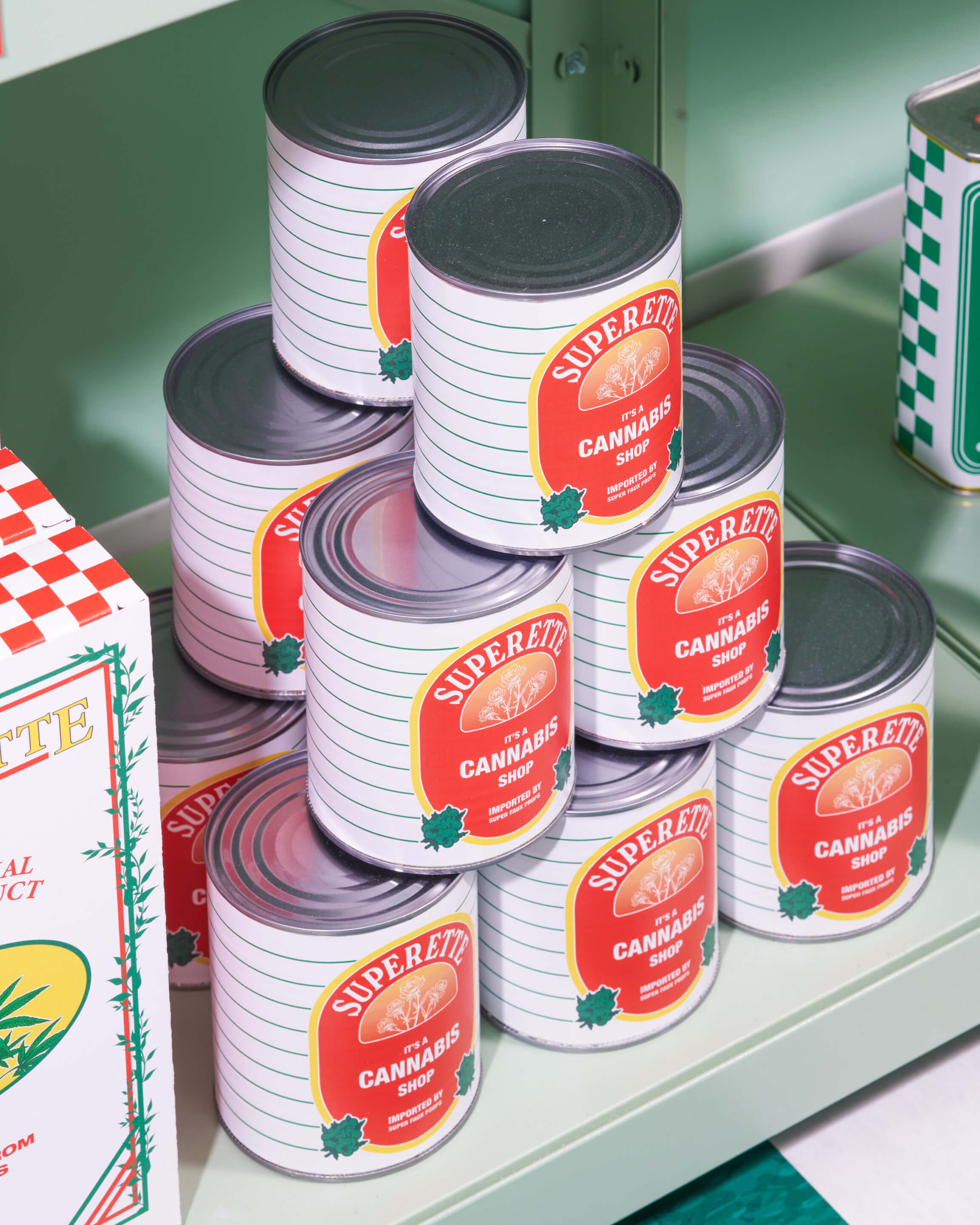 cans of prop tomato sauce with weed dispensary branding