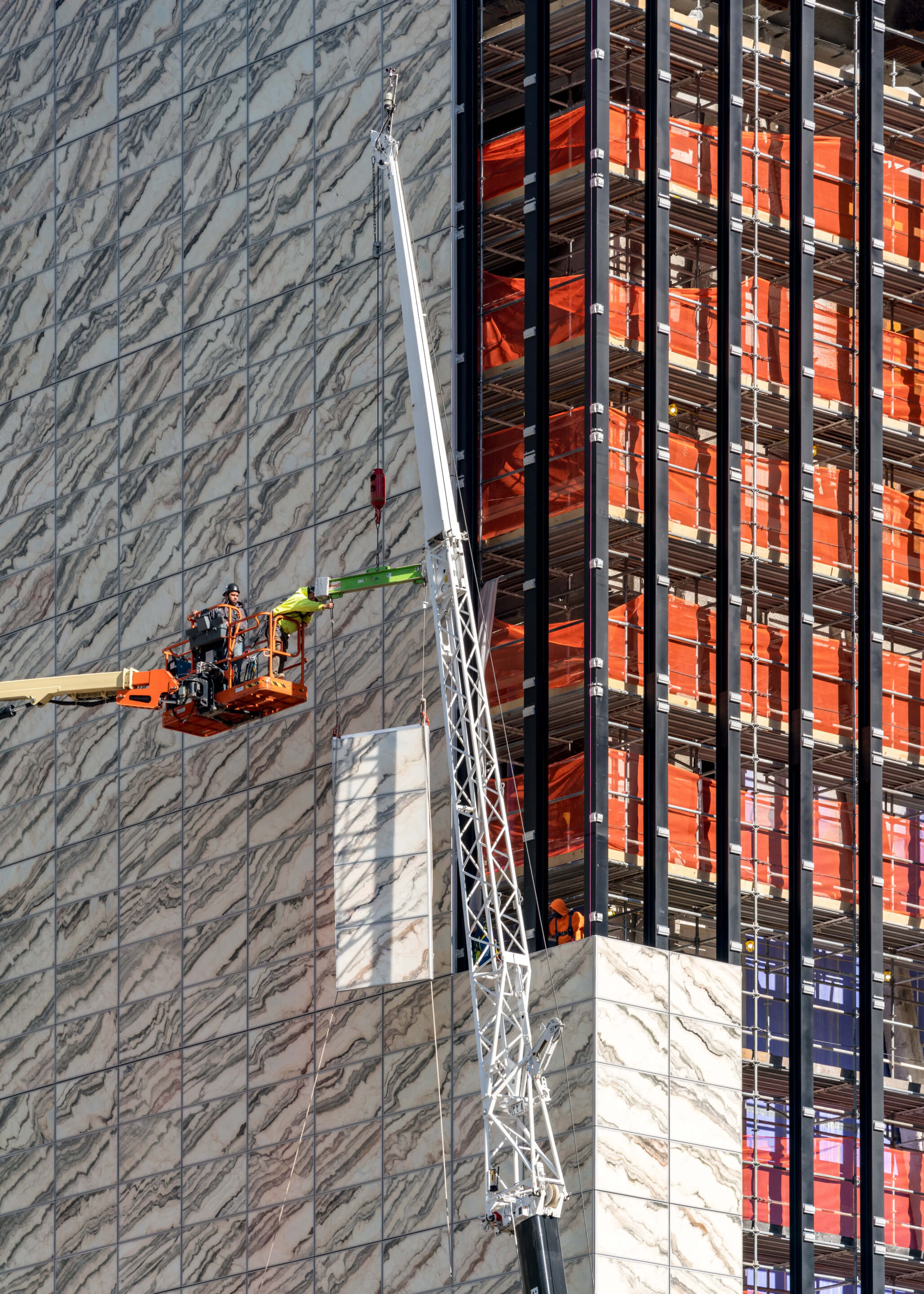 construction crew installing a building facade