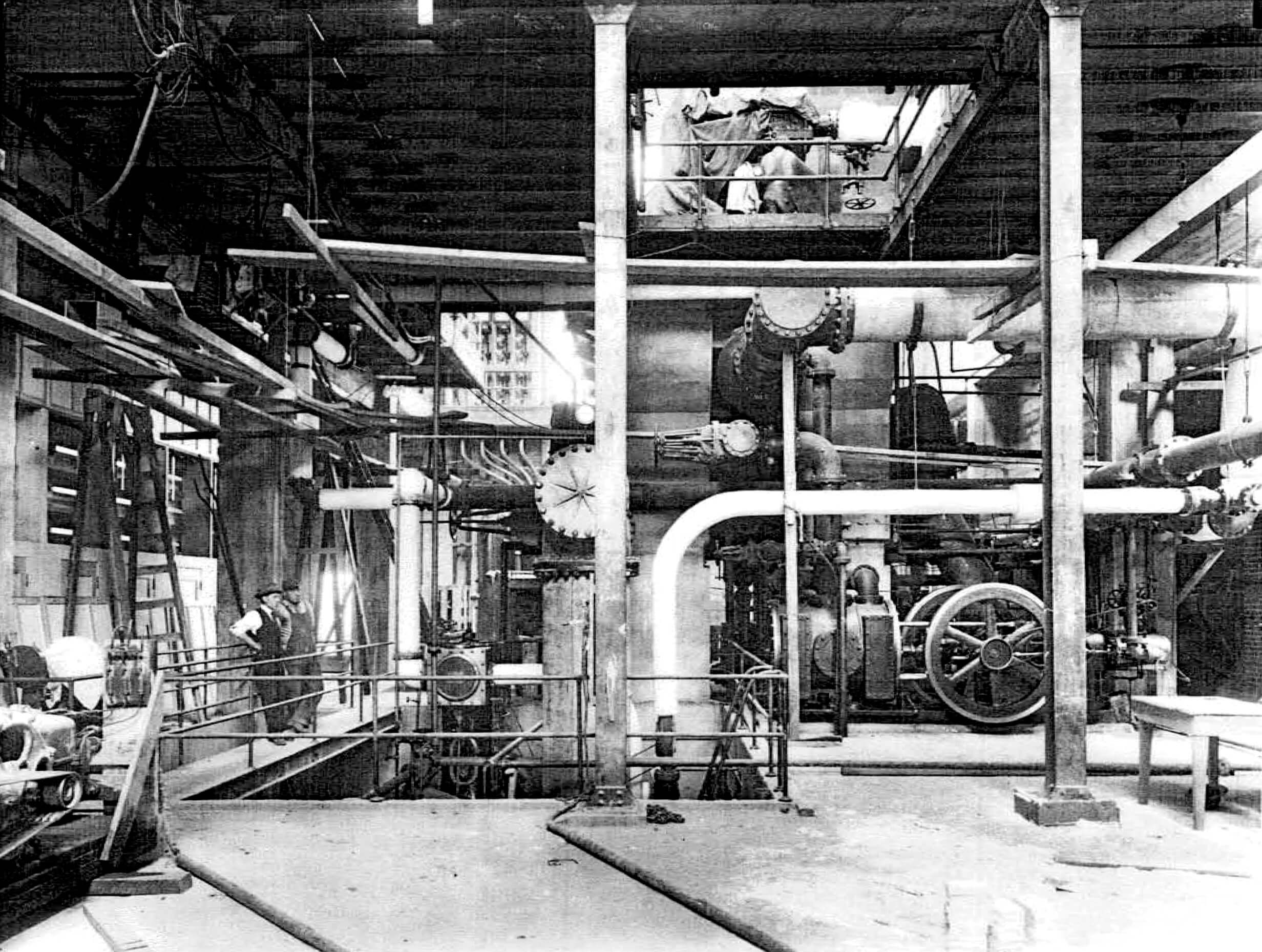 historic photograph showing machinery inside a steam electric power plant