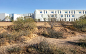 Horizontal view of a building in a desert landscape