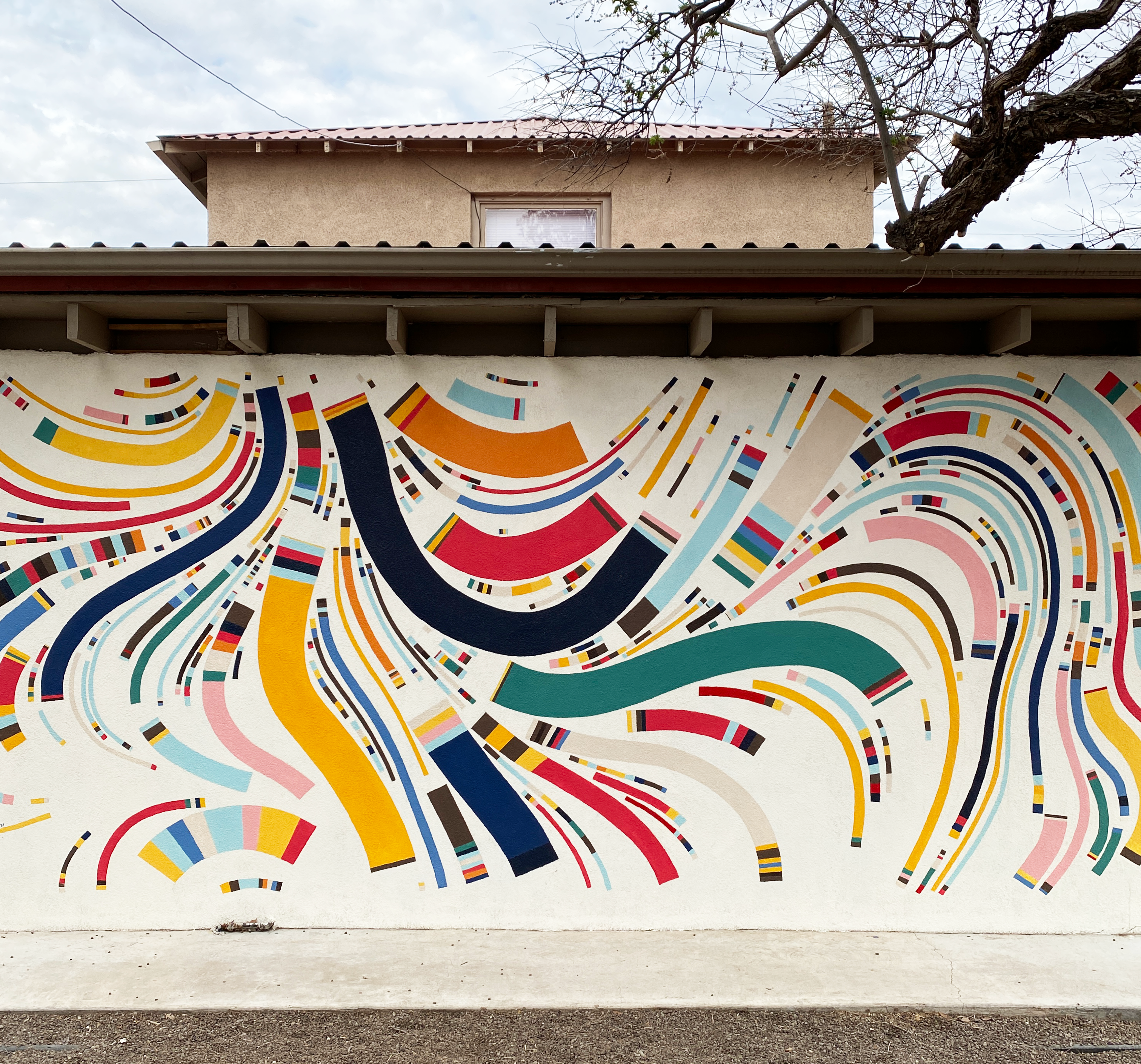 a colorful mural on a wall 