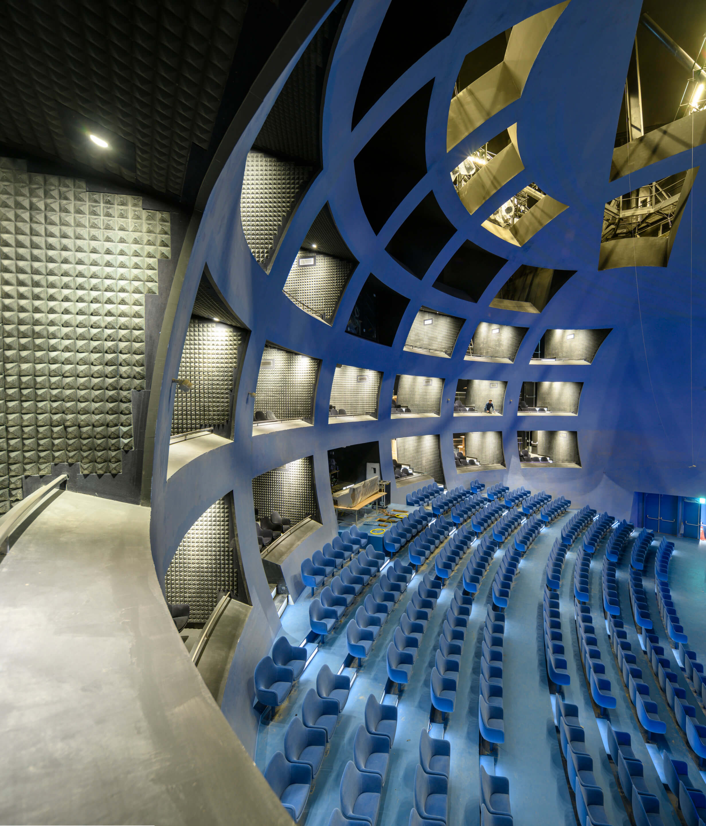 a globe-shaped theater space with a blue grid