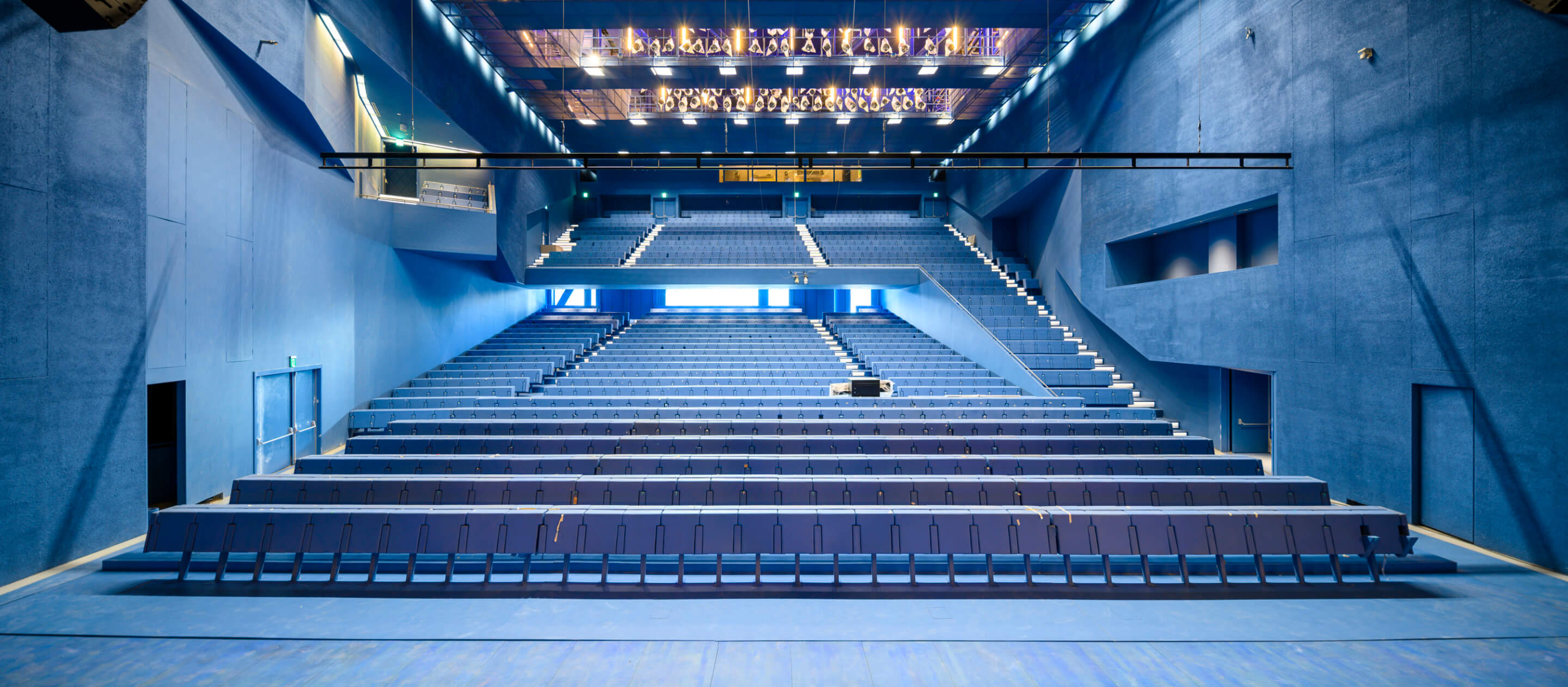 a blue-hued theater space