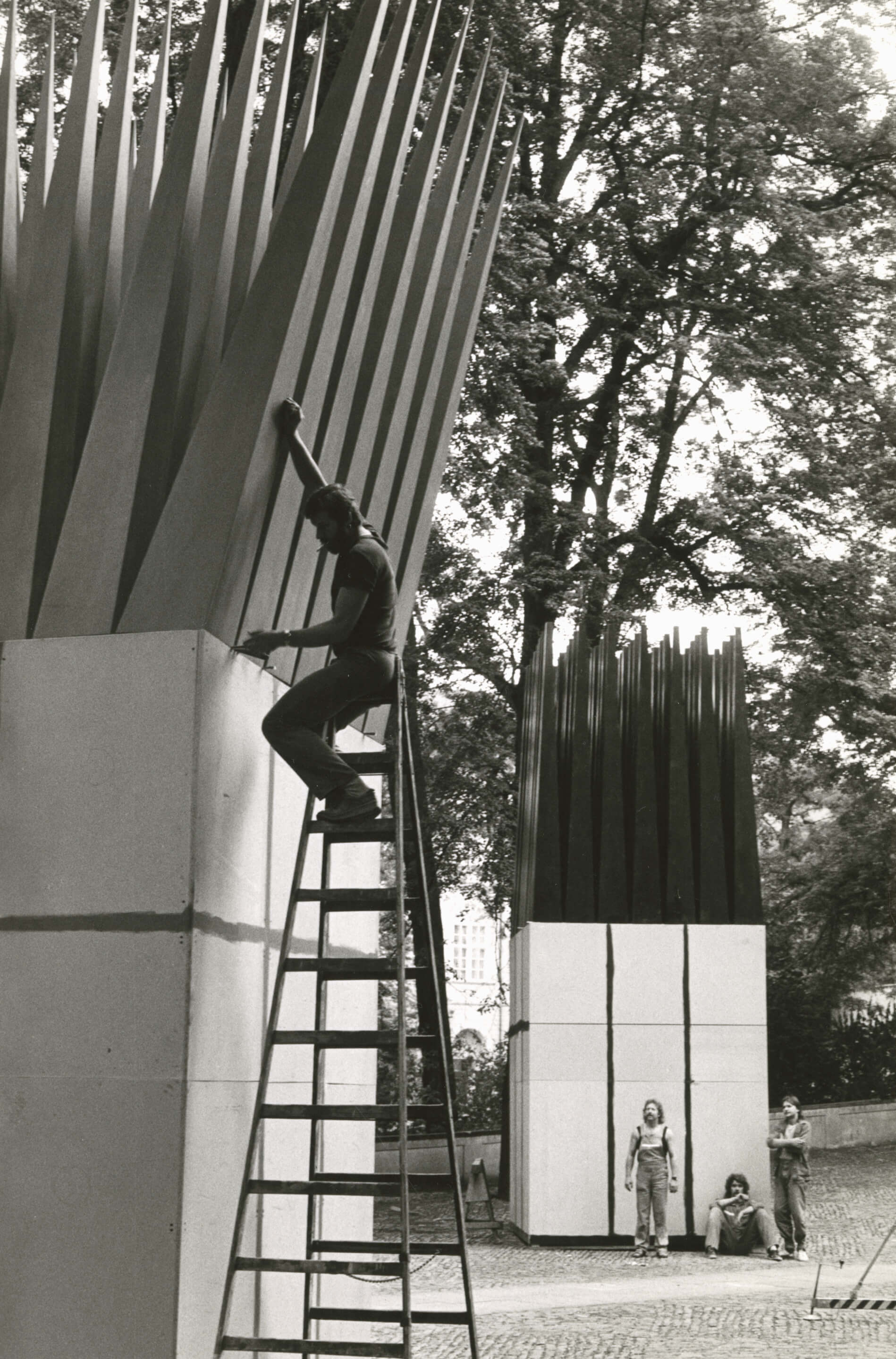 a black and white photo of construction on a czech memorial