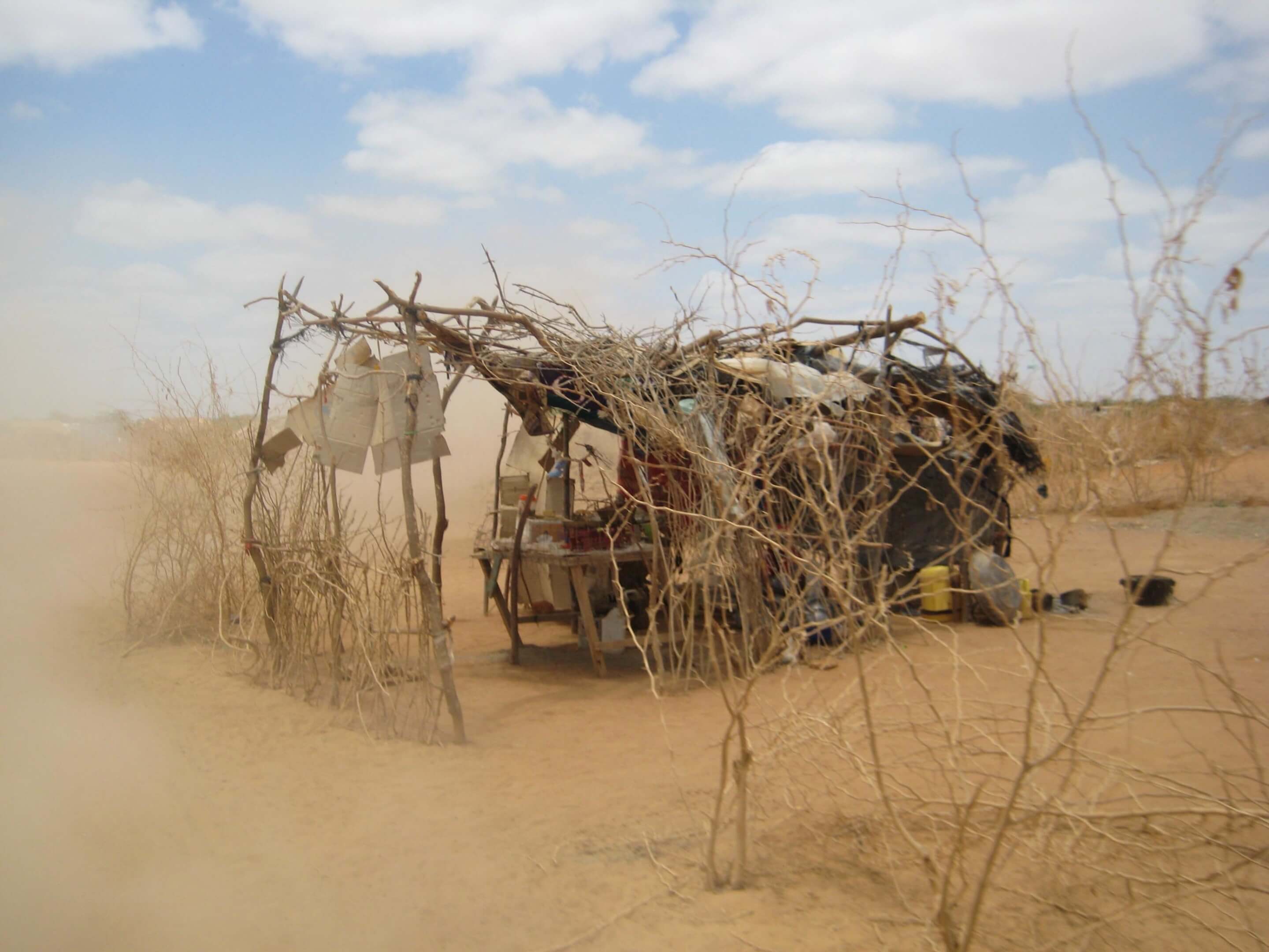 a makeshift shelter in the desert