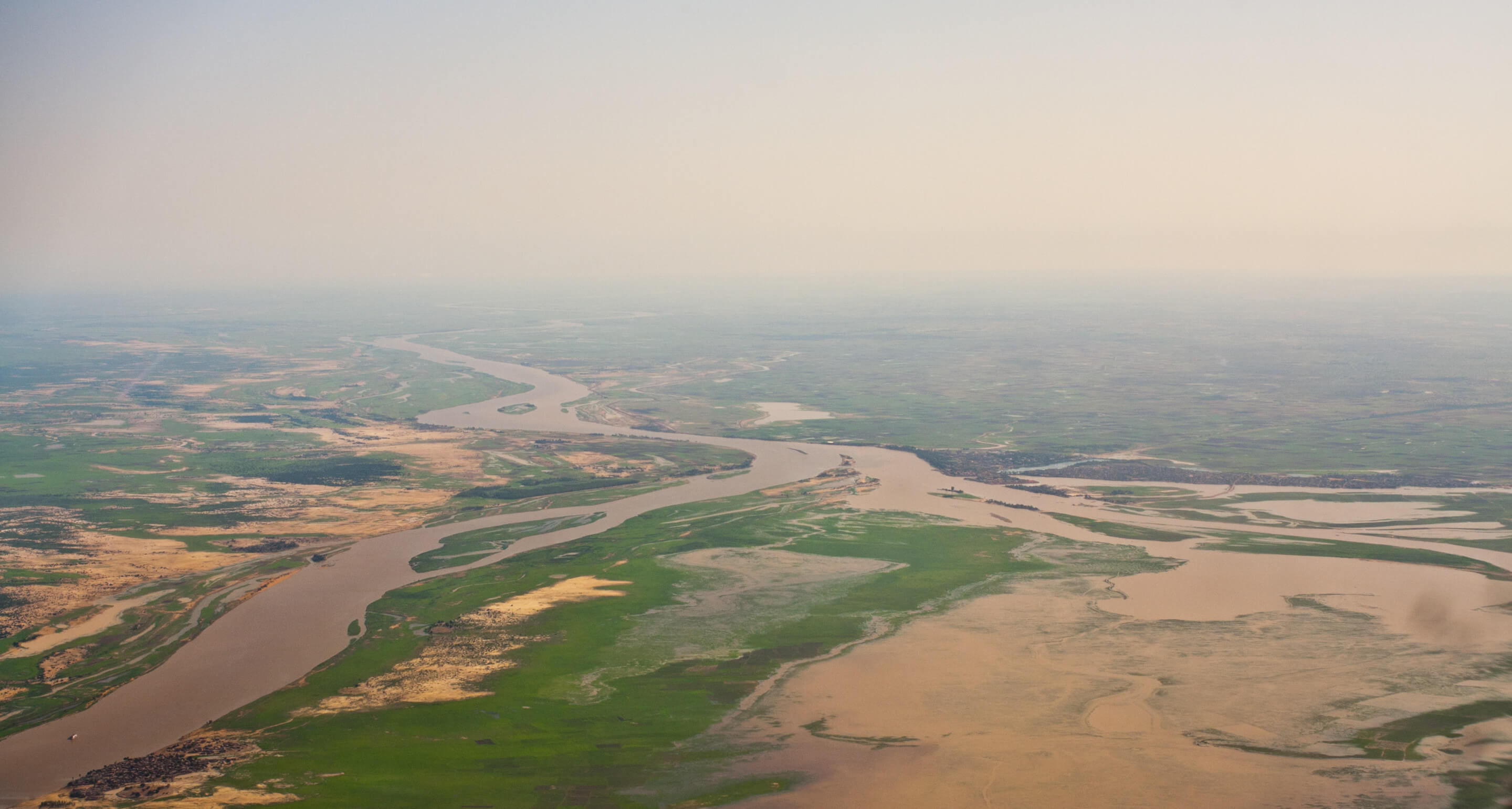 aerial view of two rivers meeting in mali, africa