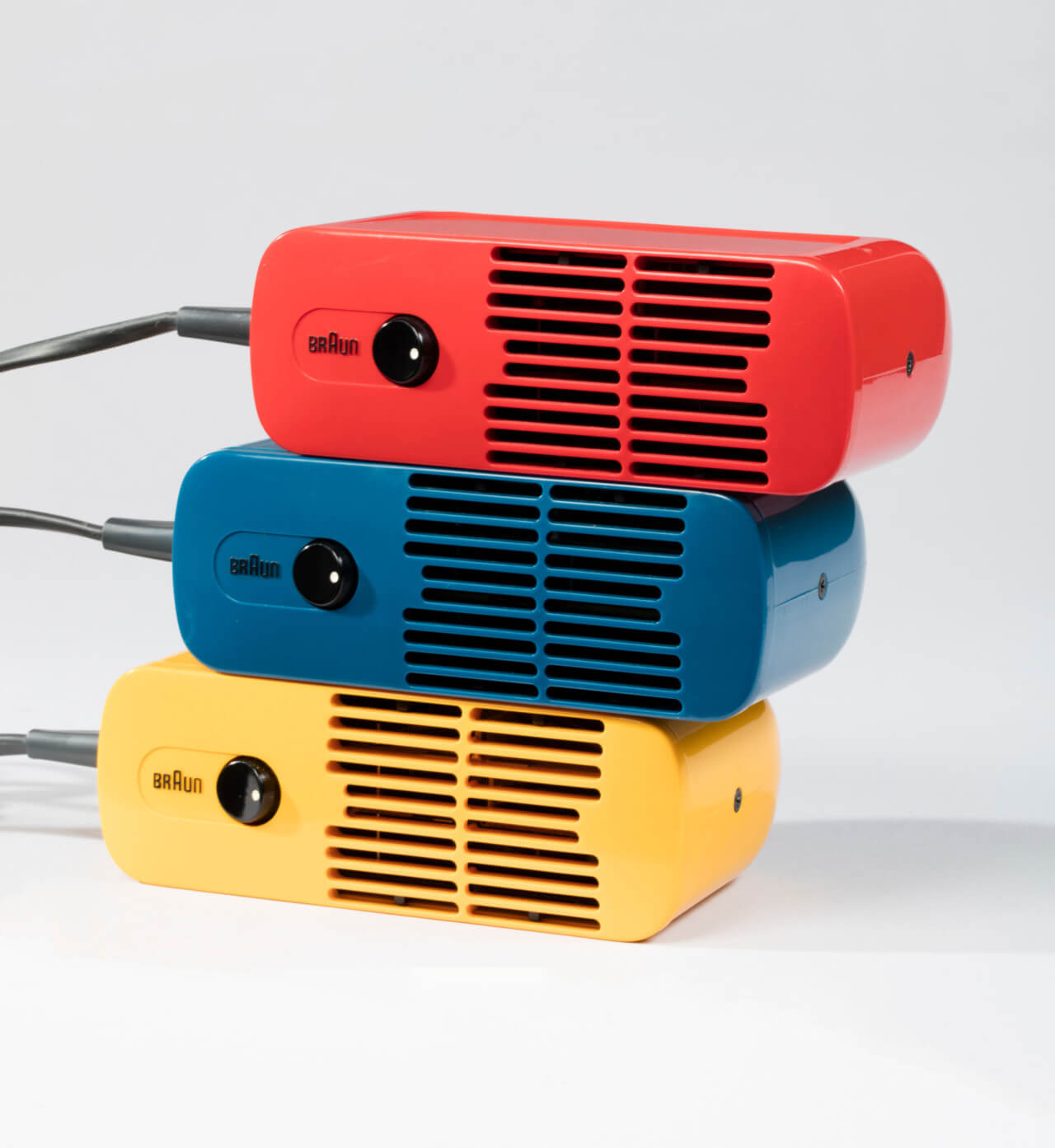 multicolored Braun portable hair dryers by Dieter Rams