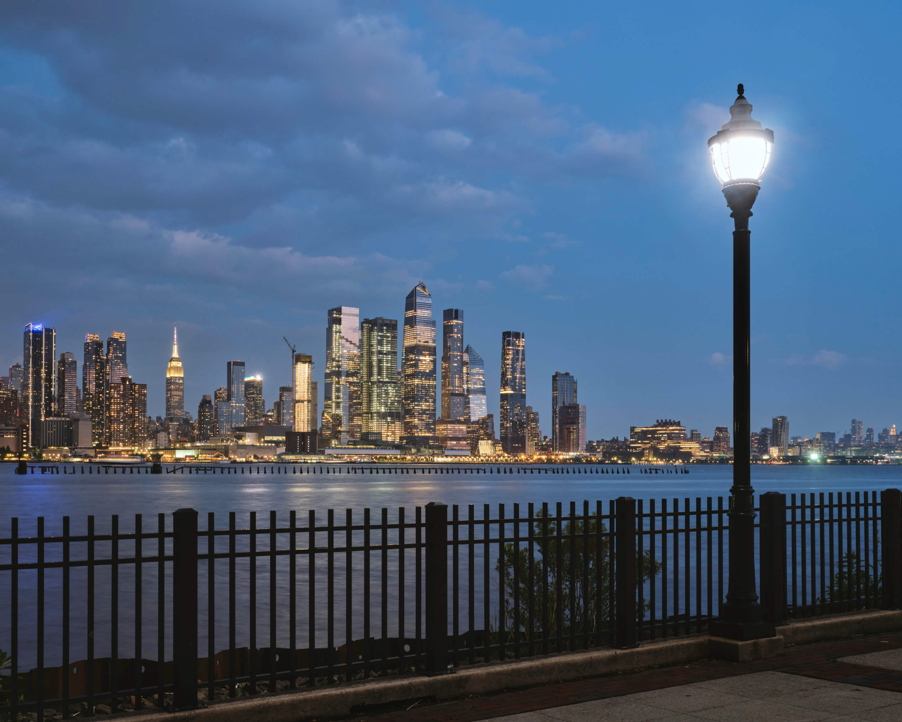 the manhattan skyline as seen at night from new jersey