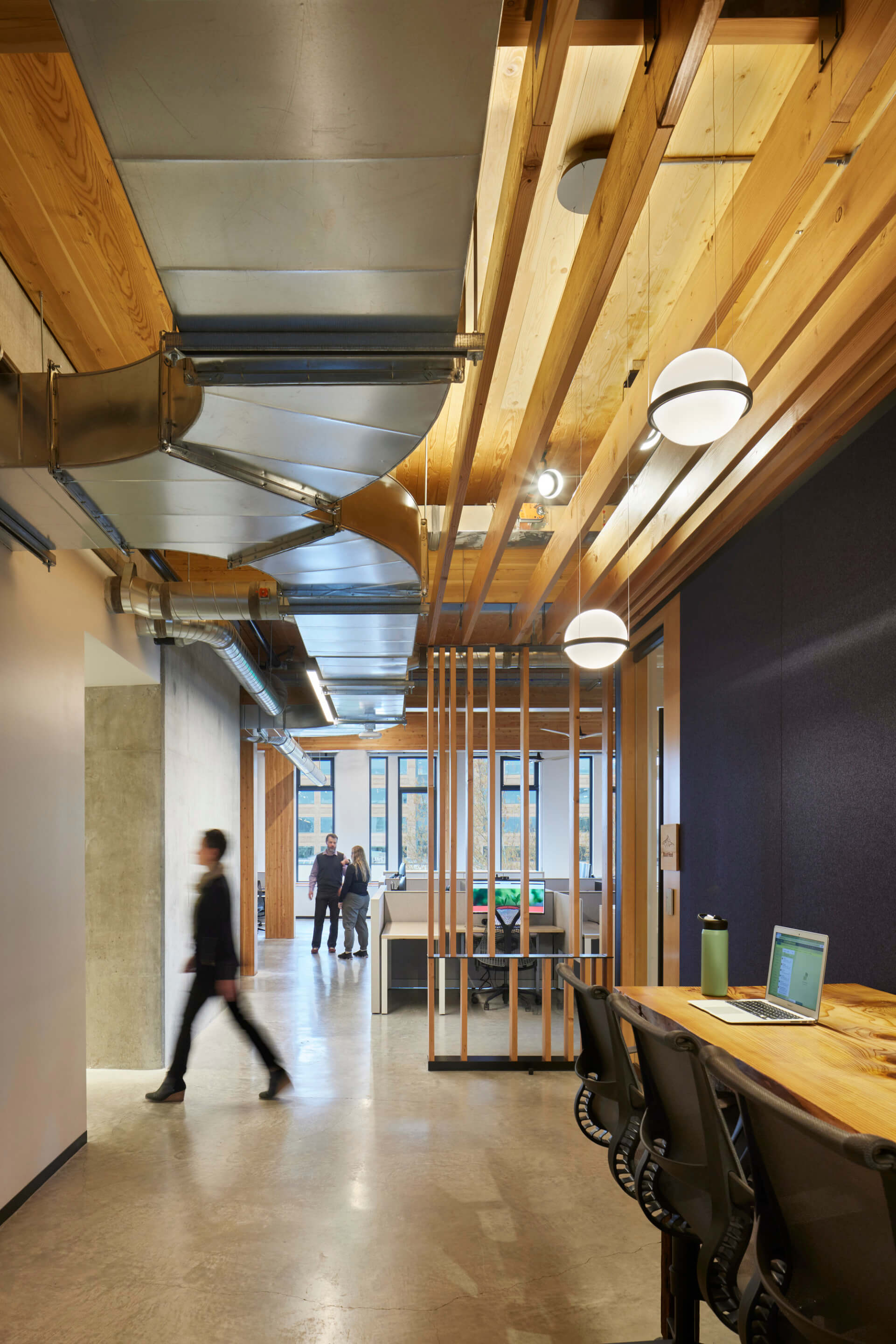 exposed wood and ductworks in an open office space
